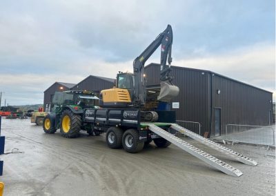 NUMAC 12T drop side trailer on the back of a lorry.